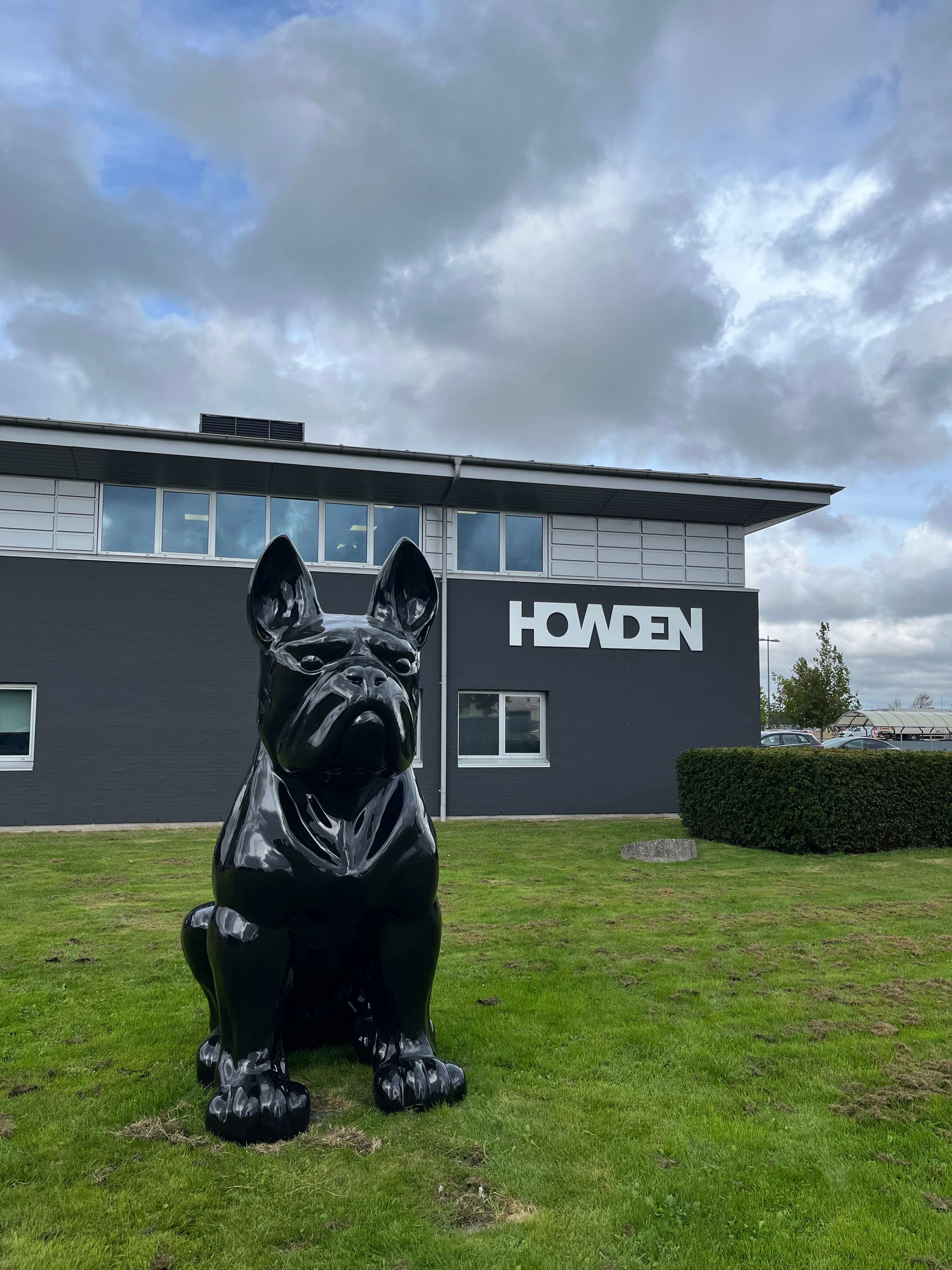 Statue of dog in front of building